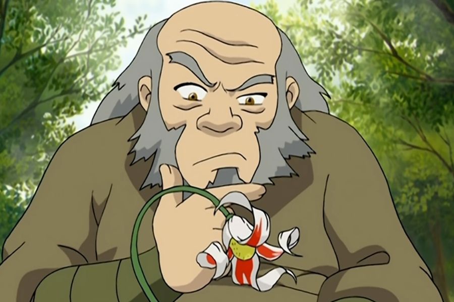 Uncle Iroh gazing at a flower