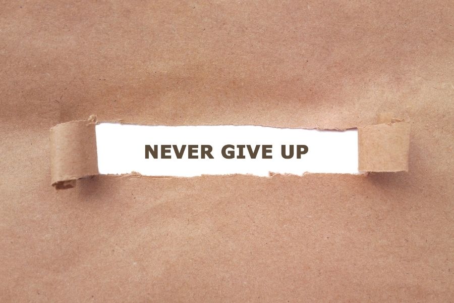 a sentence about never giving up 