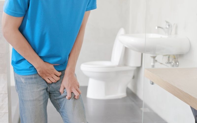 a man in toilet with Urophobia issue