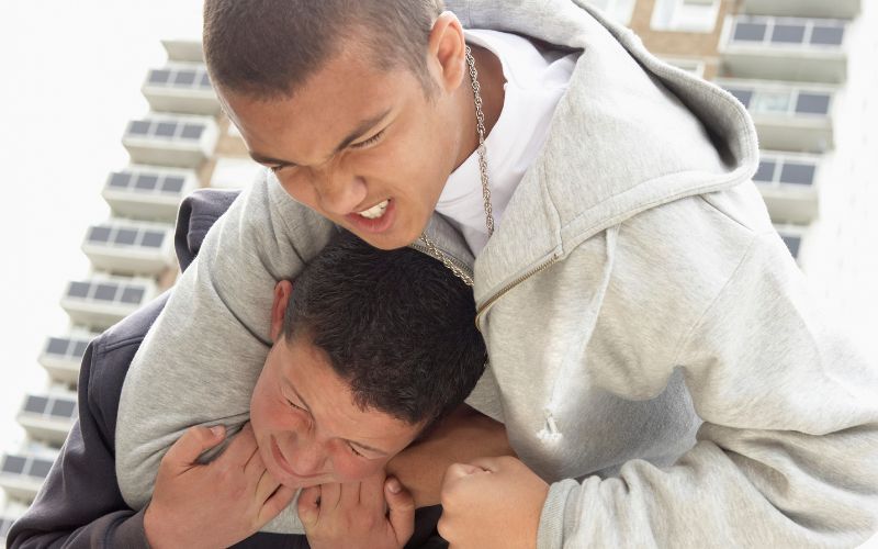 Teenage boys fighting