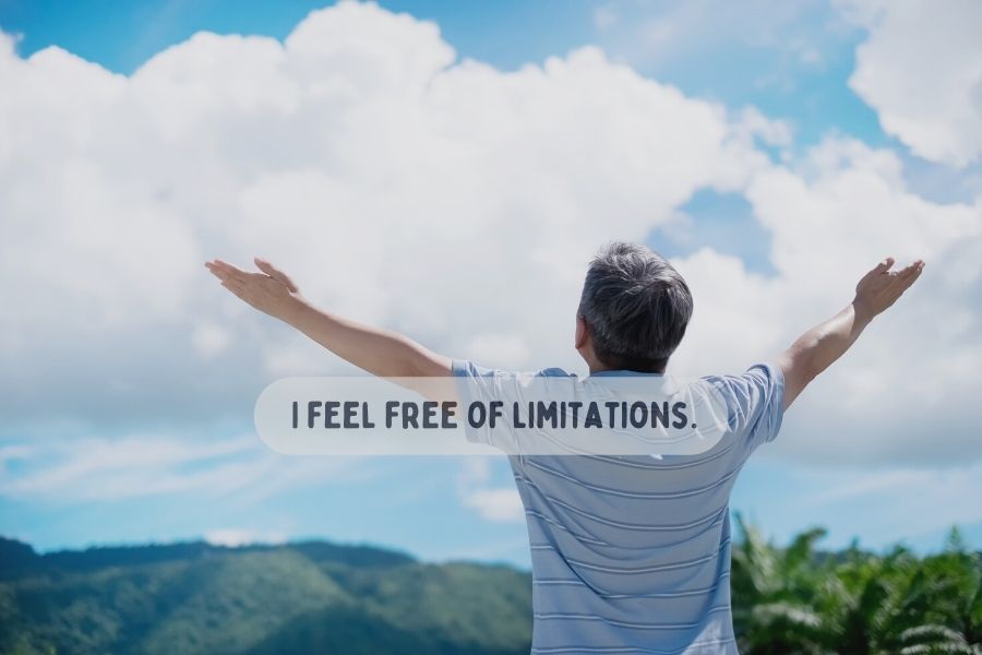 A man opening his arms in mountain and saying "I feel free of limitations" 