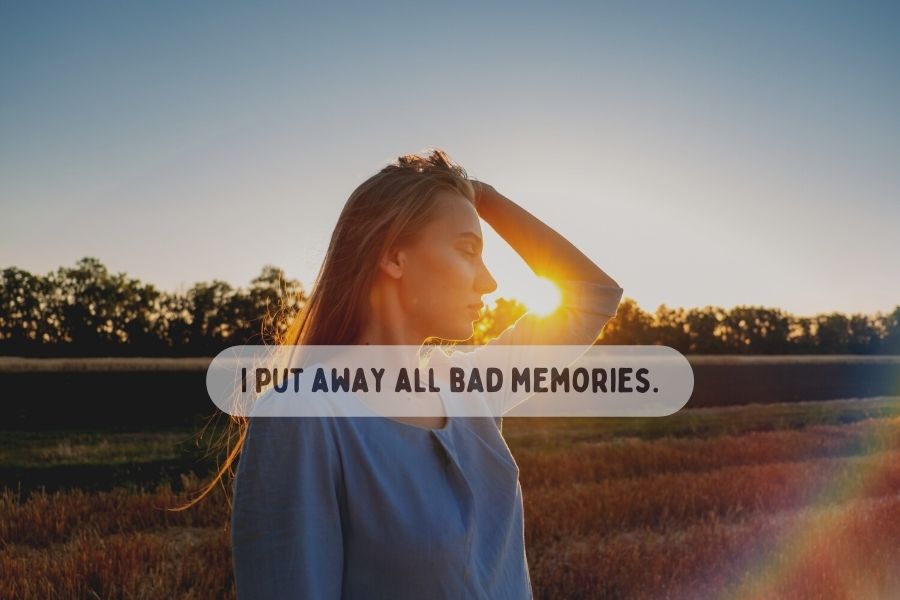 A woman in sunset with a new this affirmation saying "I put away all bad memories"