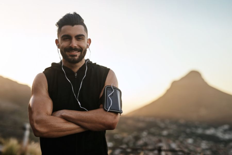 Portrait of a young, confident man with self Discipline who is exercising outdoors