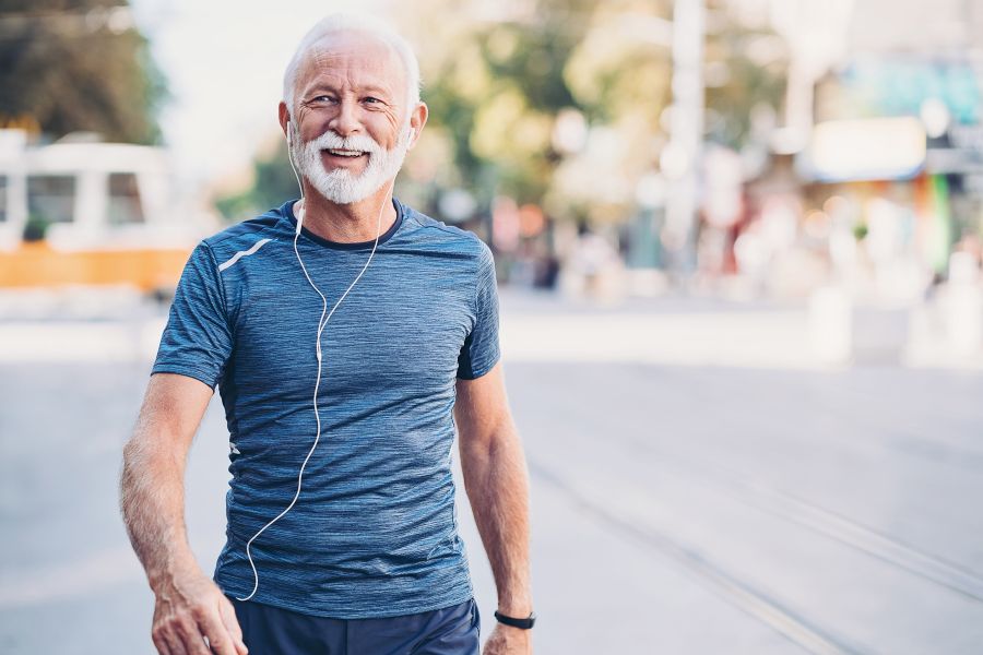 Old entrepreneur exercising outdoor in city