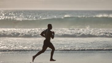 A man running at the beach representing you got this quotes
