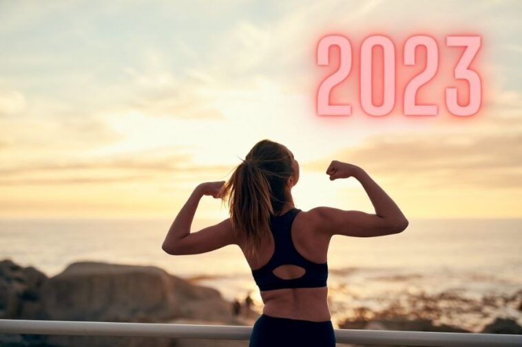 An atelic woman standing in sunrise representing healthy habits for 2023