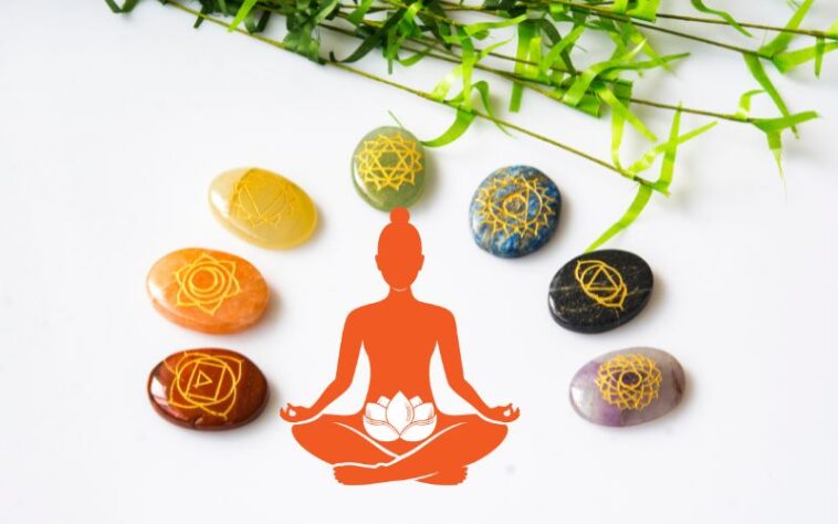 7 chakra stones with a woman doing Sacral Chakra Affirmations